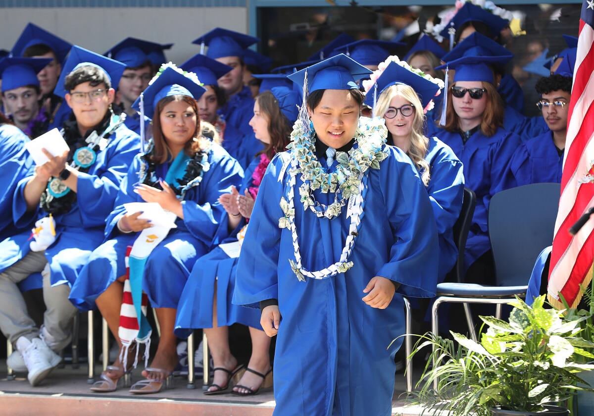 Student speaker Kyle Nguyen walks to the podium for his comments during the Valley Vista High graduation ceremony.