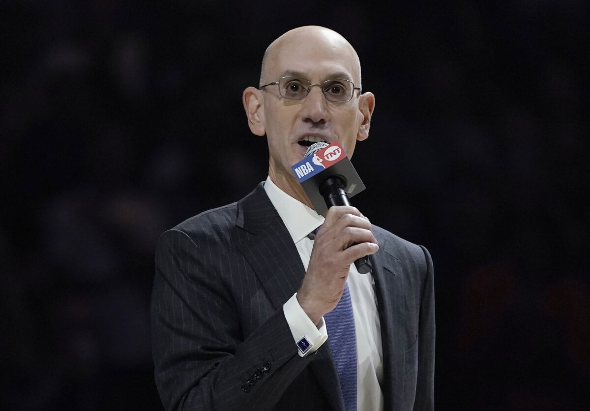 FILE - NBA Commissioner Adam Silver speaks before an NBA basketball game between the Milwaukee Bucks and the Brooklyn Nets on Oct. 19, 2021, in Milwaukee. The NBA plans to keep its next All-Star Game in Salt Lake City, despite its opposition to Utah's ban on transgender youth athletes playing on girls teams. The Utah Jazz are set to host the event next February and Silver said it will stay put as planned. (AP Photo/Morry Gash, File)