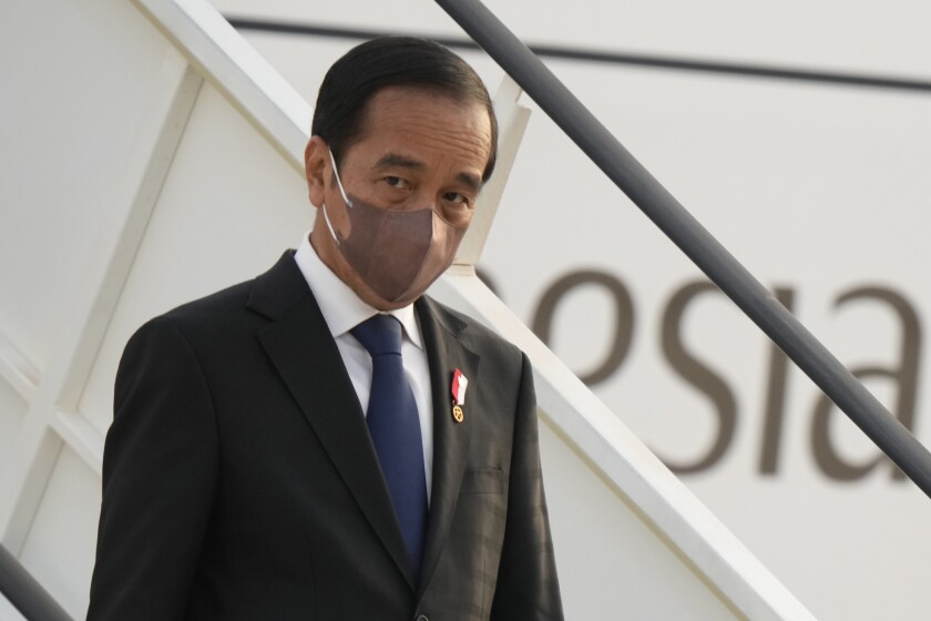FILE - Indonesia's President Joko Widodo arrives at Rome's Fiumicino Airport, on Oct. 29, 2021. The Indonesia’s leader said Thursday, Jan. 20, 2022, that his country, which holds the presidency of the Group of 20 biggest economies this year, sought to strengthen global partnership and inclusiveness to aid the economic recovery amid a resurgent COVID-19 pandemic. (AP Photo/Andrew Medichini)