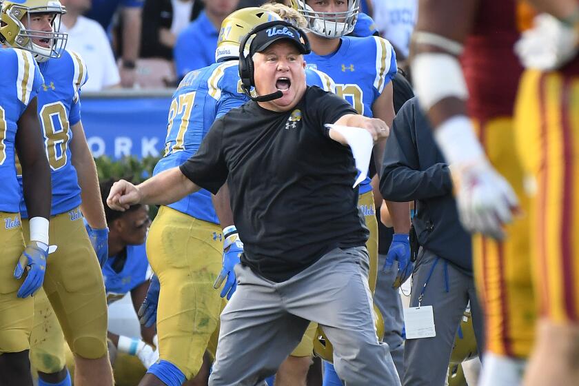 PASADENA, CALIFORNIA OCTOBER 17, 2018-Bruins head coach Chip Kelly cheers fires up his team against USC at the Rose Bowl Saturday. (Wally Skalij/Los Angeles Times)