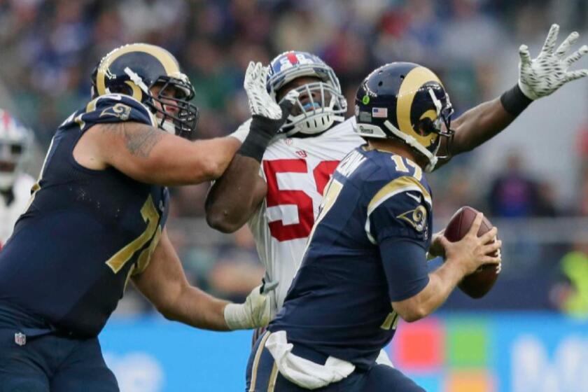 Giants defensive end Owa Odighizuwa is blocked as he tries to get to Rams quarterback Case Keenum during a game in London on Oct. 23.