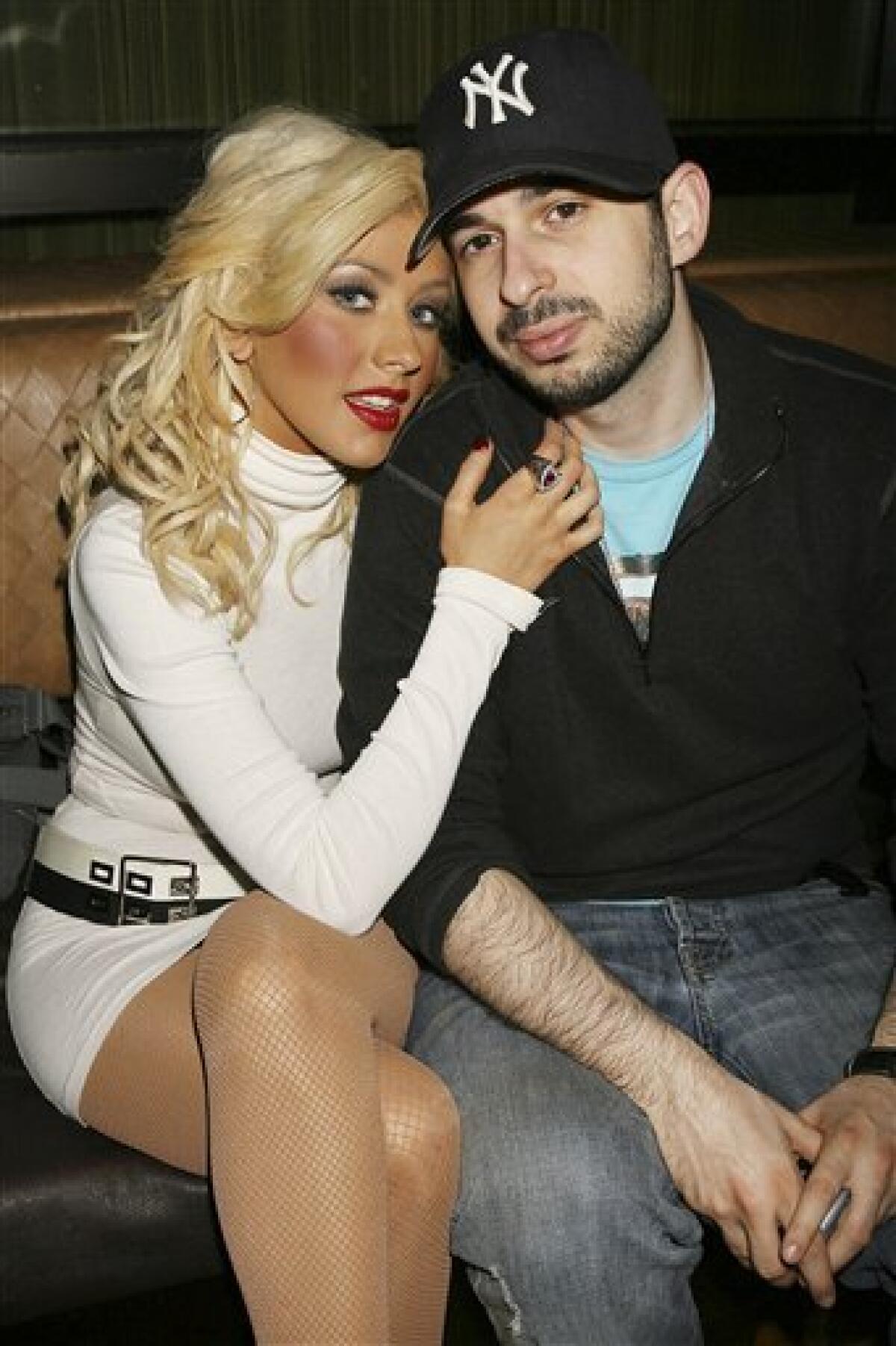 FILE - In this March 23, 2007 file photo originally provided by Starpix, singer Christina Aguilera and her husband Jordan Bratman attend a party at the Marquee club in New York. (AP Photo/Dave Allocca, Starpix, file)