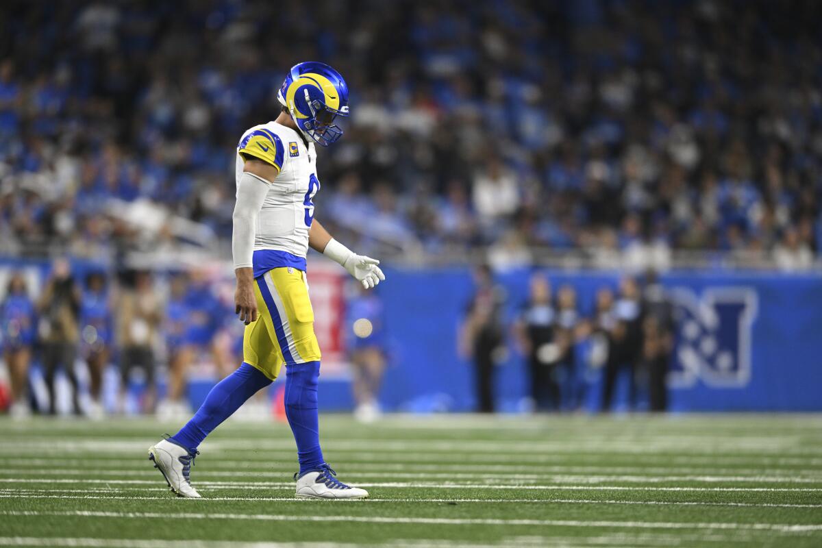 Rams quarterback Matthew Stafford walks on the field against the Detroit Lions during the first half Sunday.