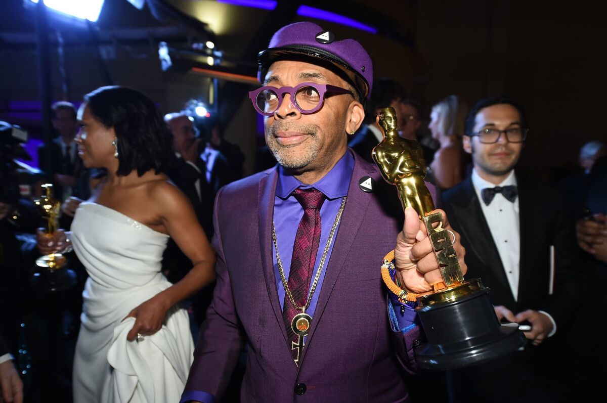 Spike Lee finally got his Oscar, but it was his purple Ozwald Boateng suit and matching glasses that helped make him an early trending topic on Twitter Sunday night.
