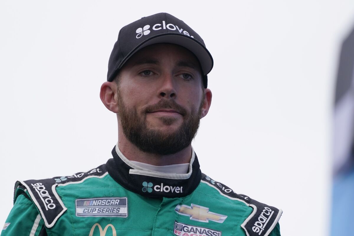 FILE - In this July 18, 2021, file photo, Ross Chastain looks on at a NASCAR Cup Series auto race in Loudon, N.H. Trackhouse Racing has signed Chastain to a multiyear contract to drive the No. 1. The 28-year-old Chastain currently drives the No. 42 Chevrolet for Chip Ganassi Racing. (AP Photo/Charles Krupa, File)