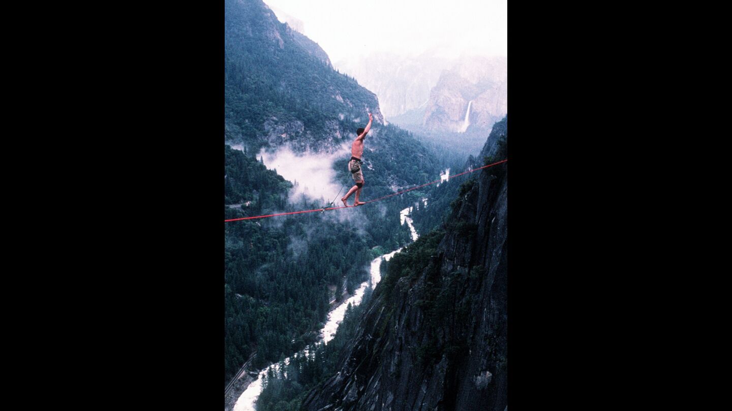 Dean Potter is shown at Yosemite, slack lining in 1998.