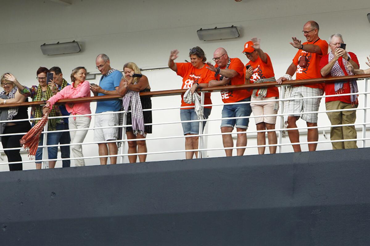 Passengers aboard the Westerdam cruise ship were allowed to disembark at the port of Sihanoukville, Cambodia, on Friday.