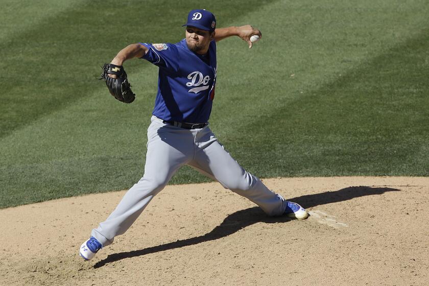 Dodgers relief pitcher Luis Avilan (43) throws against the Arizona Diamondbacks during a spring training game in Scottsdale, Ariz. on March 18.