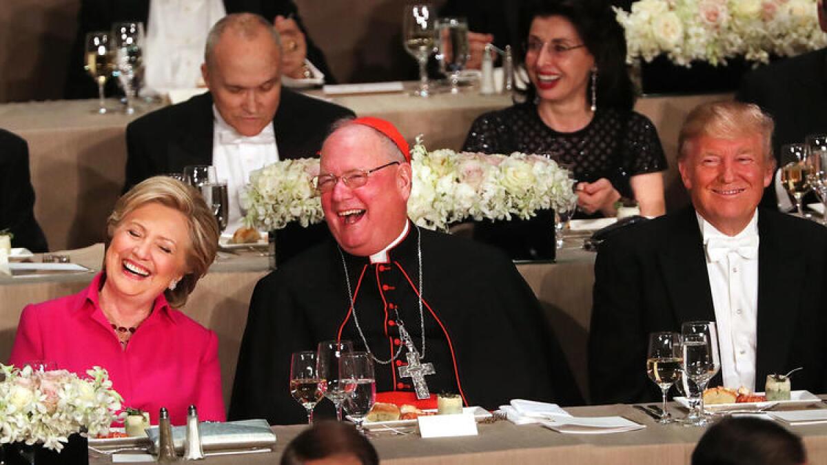 Hillary Clinton and Donald Trump had only Cardinal Timothy Dolan separating them at the annual Alfred E. Smith Memorial Foundation Dinner in New York.