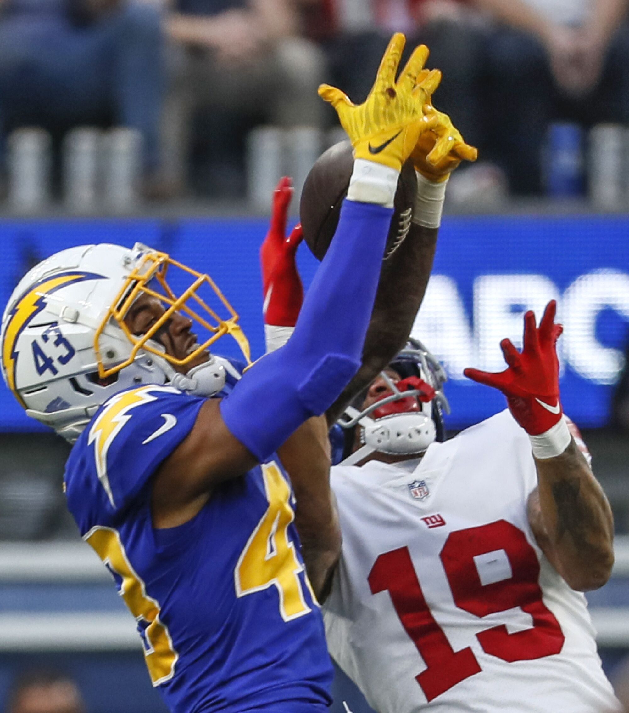 Chargers cornerback Michael Davis breaks up a pass intended for New York Giants wide receiver Kenny Golladay.