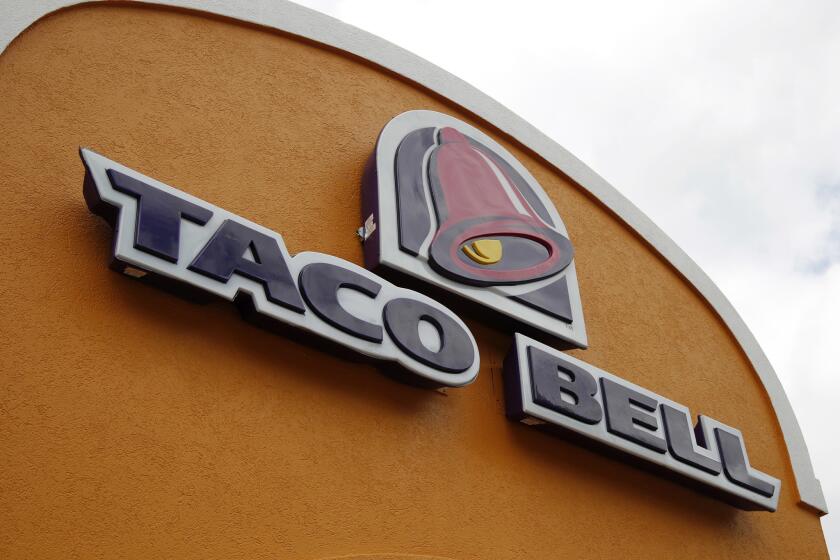 FILE - This Friday, May 23, 2014, file photo, shows the sign at a Taco Bell in Mount Lebanon, Pa. Taco Bell announced plans on Jan. 11, 2017, to go nationwide with its Naked Chicken Chalupa, a taco with a shell made out of fried chicken. (AP Photo/Gene J. Puskar, File)