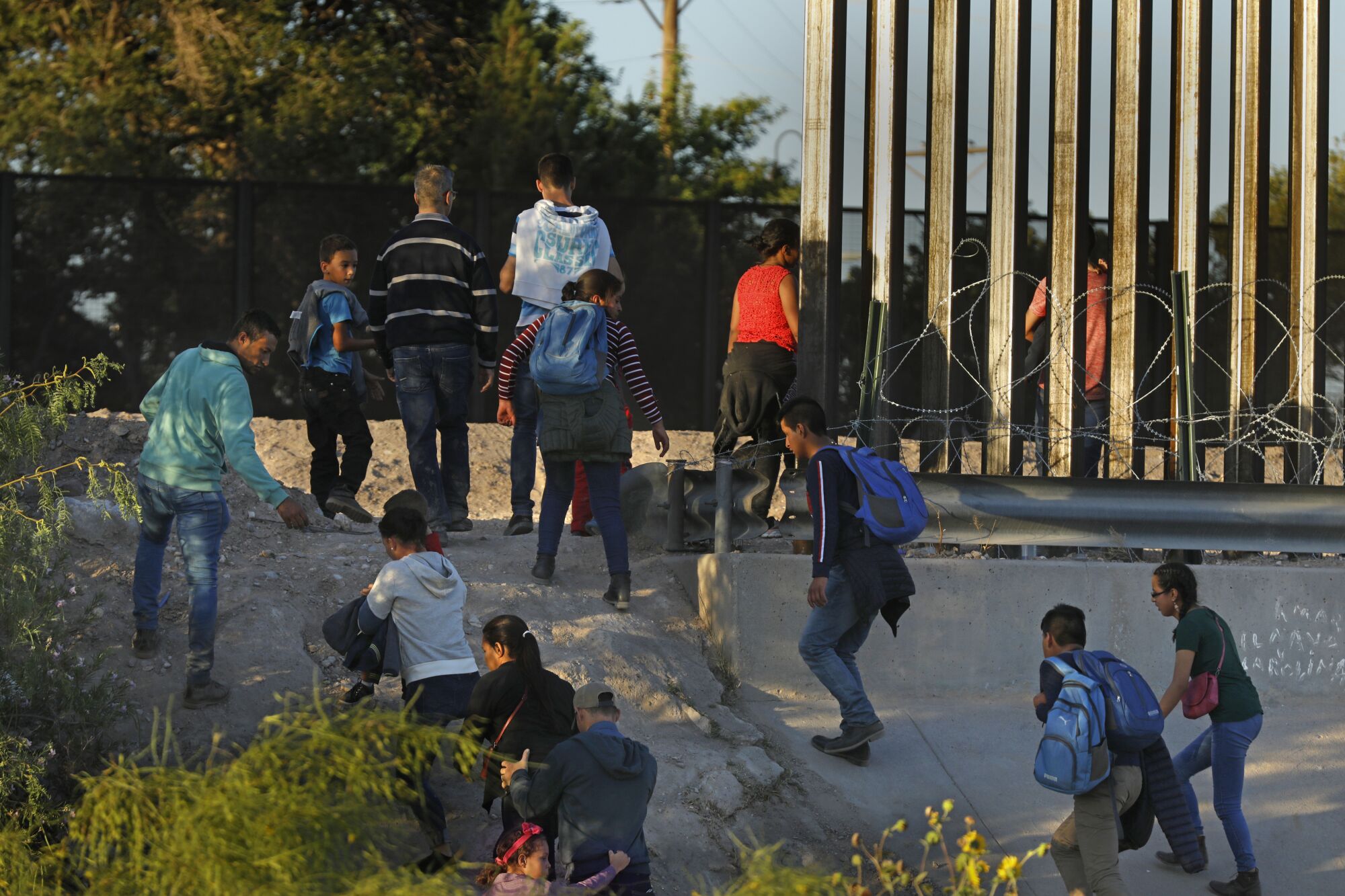 Migrants cross from Juarez, Mexico, to El Paso, where Border Patrol agents wait to take them into custody.