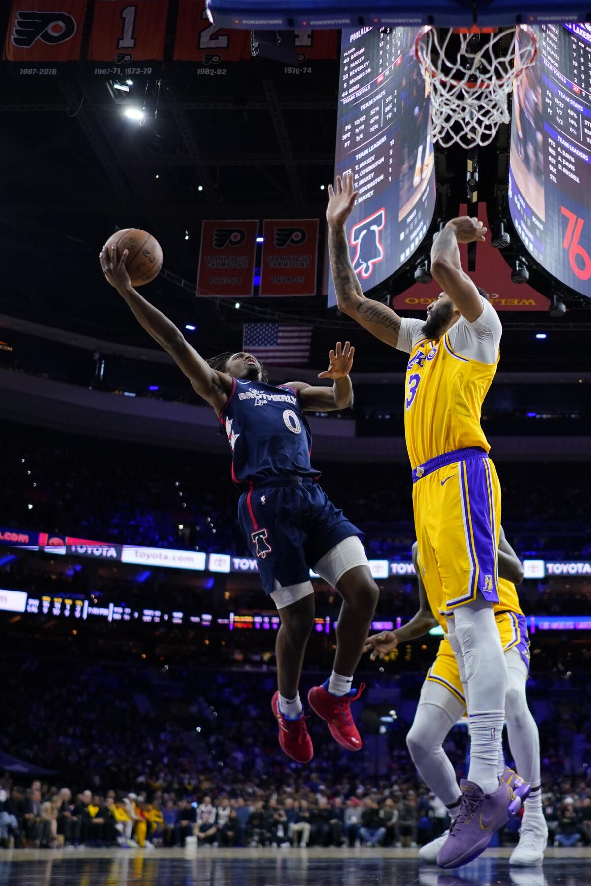 Philadelphia's Tyrese Maxey goes up for a shot against Lakers star Anthony Davis during Monday's game.