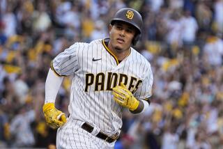 San Diego Padres' Manny Machado celebrates his home run during the seventh inning in Game 2.