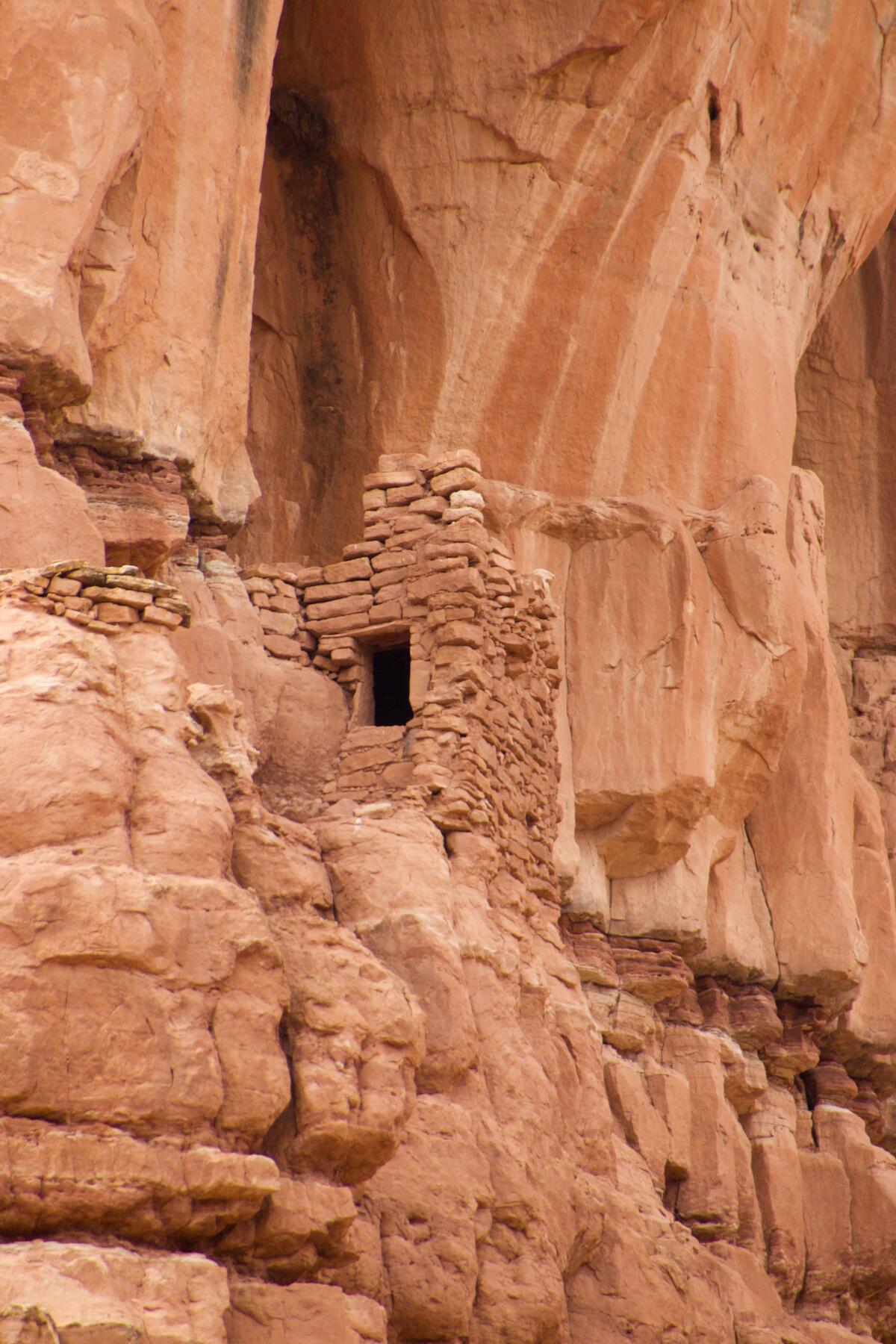 Cliff dwellings and other structures line the canyon walls of the Cottonwood Wash.