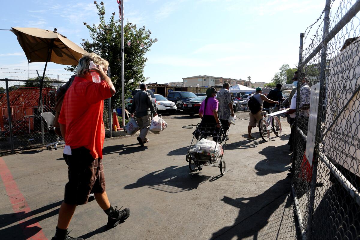 Homeless people and others who need assistance enter Mary's Kitchen, a homeless service provider in Orange.