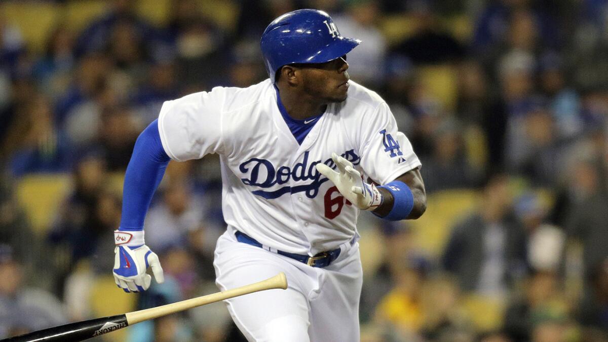 Dodgers right fielder Yasiel Puig hits a double during the sixth inning of a 7-3 loss to the San Diego Padres at Dodger Stadium on April 7.