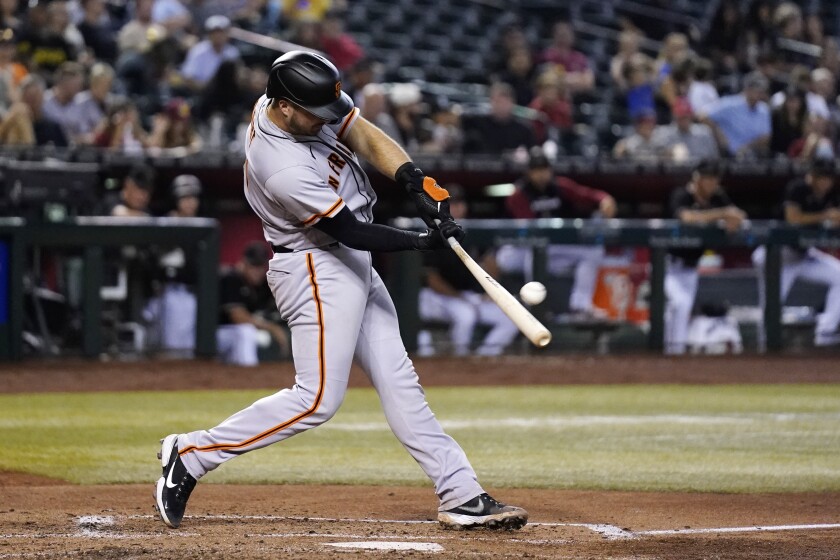 San Francisco Giants' Joey Bart hits an RBI double against the Arizona Diamondbacks during the fifth inning of a baseball game Wednesday, July 6, 2022, in Phoenix. (AP Photo/Ross D. Franklin)