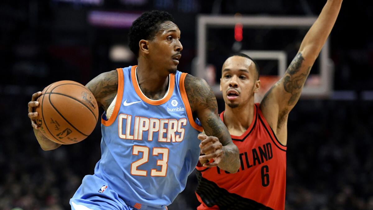 Los Angeles Clippers guard Lou Williams (23) drives against Portland Trail Blazers guard Shabazz Napier (6) during an NBA basketball game, Sunday, March 18, 2018, in Los Angeles. (AP Photo/Michael Owen Baker)