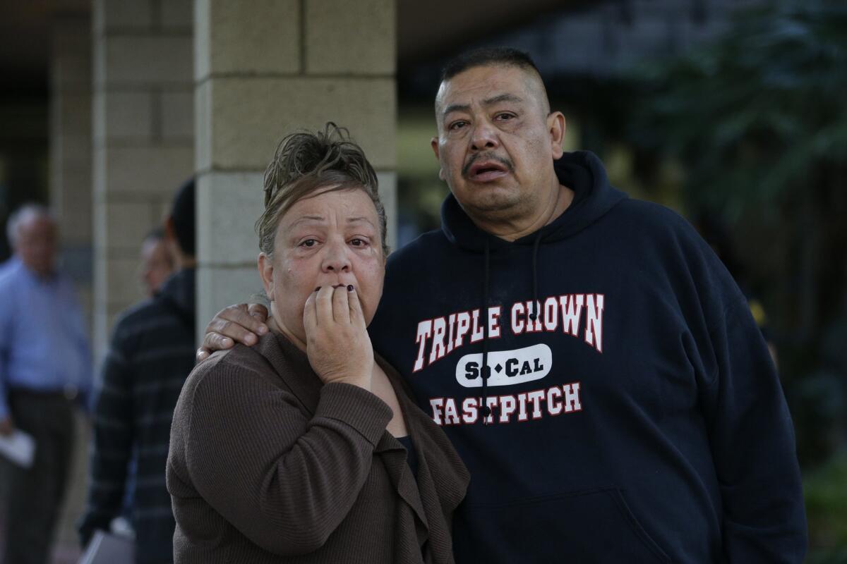 People wait at a community center for a family member who was near a shooting that killed multiple people at a social services center in San Bernardino on Dec. 2.