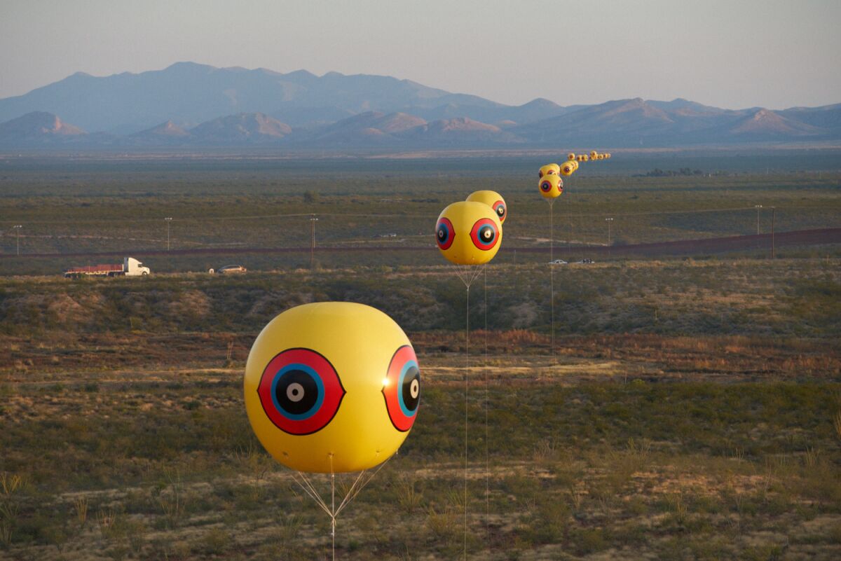Postcommodity's balloons are partly modeled on scare-eye balloons, used to ward off birds. 