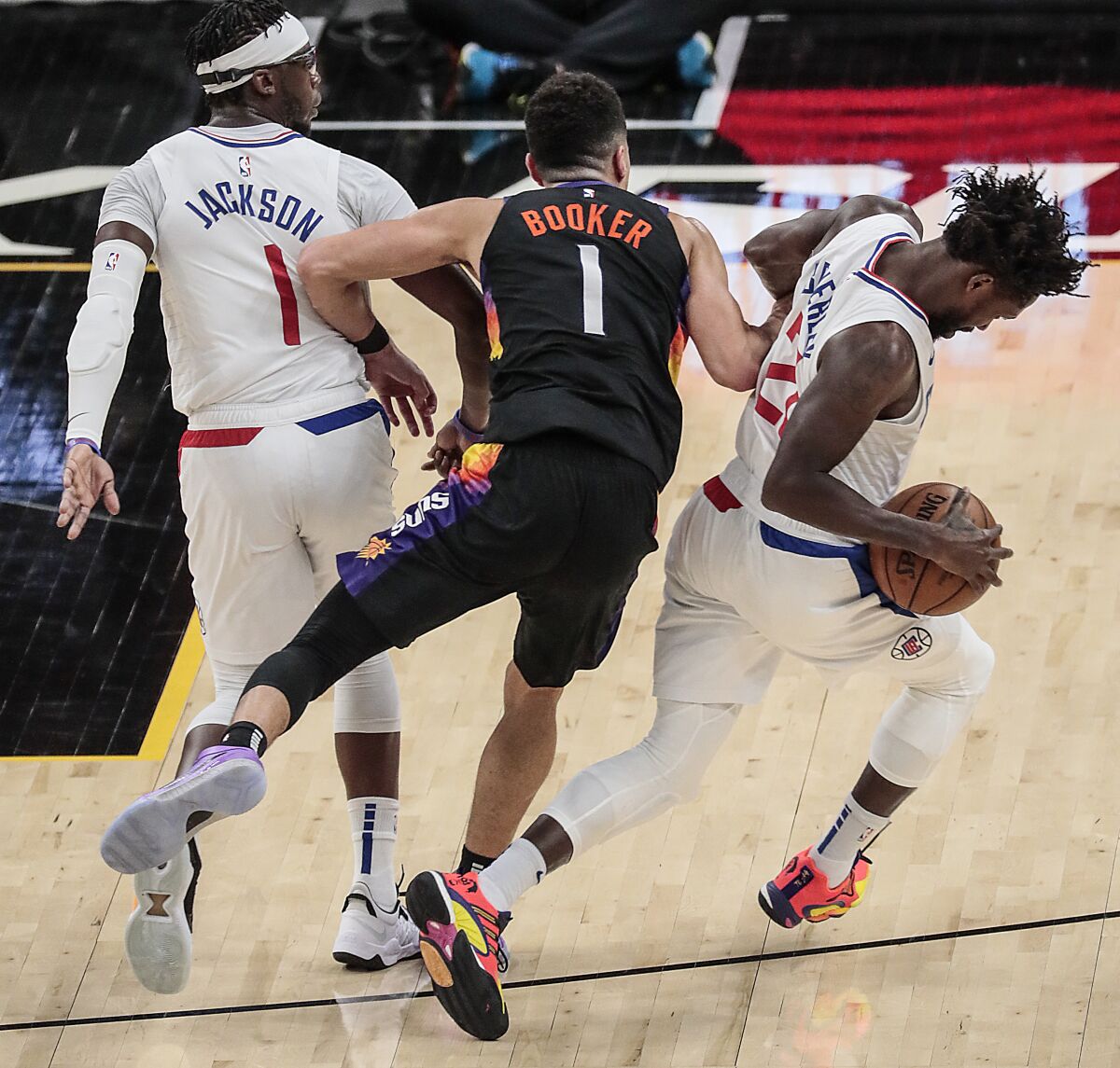 Clippers guard Patrick Beverley steals the ball from Suns guard Devin Booker during Game 2.