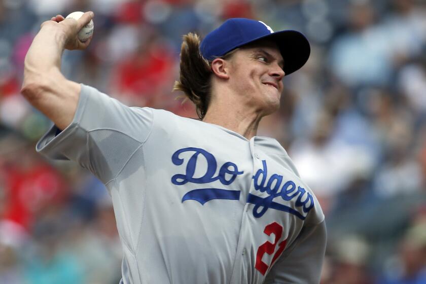 Dodgers starter Zack Greinke delivers a pitch during the third inning against the Washington Nationals on Sunday.