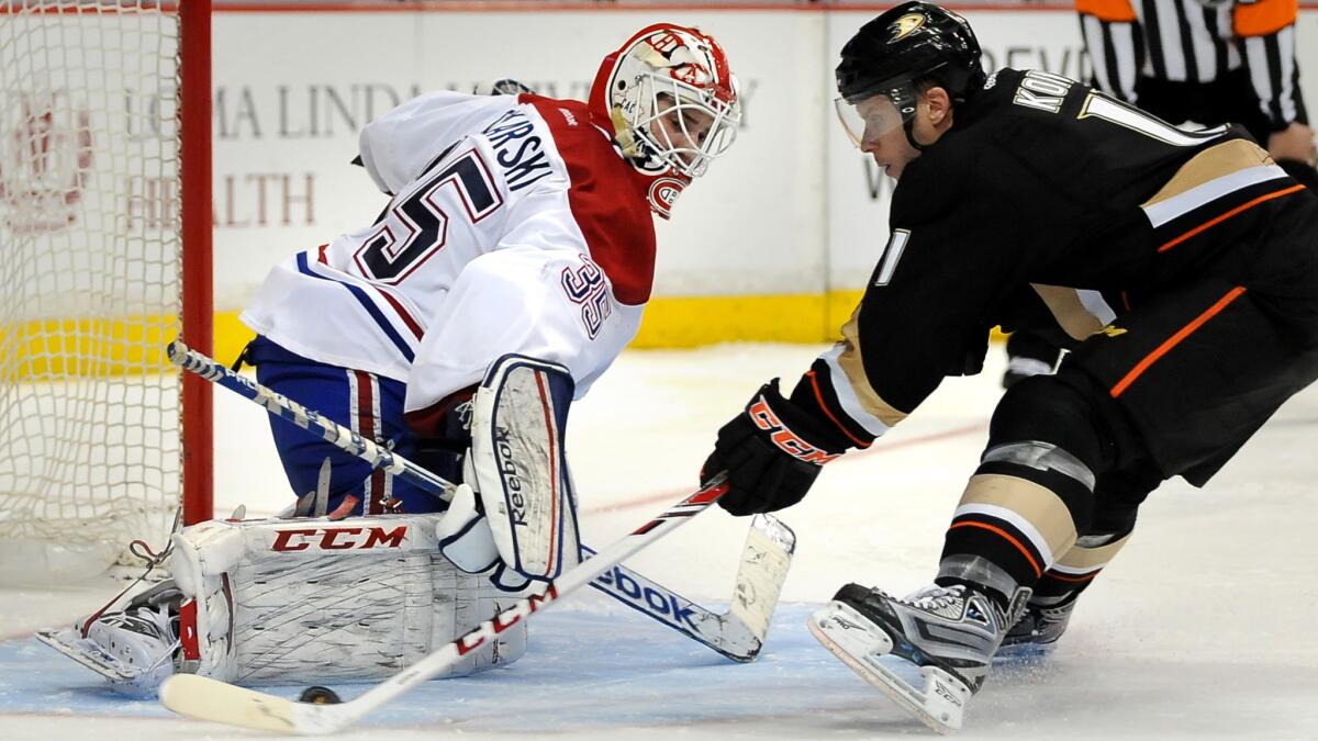 Canadiens goalie Dustin Tokarski makes a save on a penalty shot by the Ducks' Saku Koivu during a a game on March 5, 2014, at Honda Center.