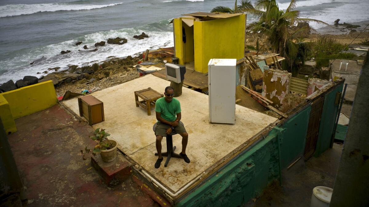 Roberto Figueroa Caballero in the ruins of his home Oct. 5 in San Juan, Puerto Rico, after Hurricane Maria.