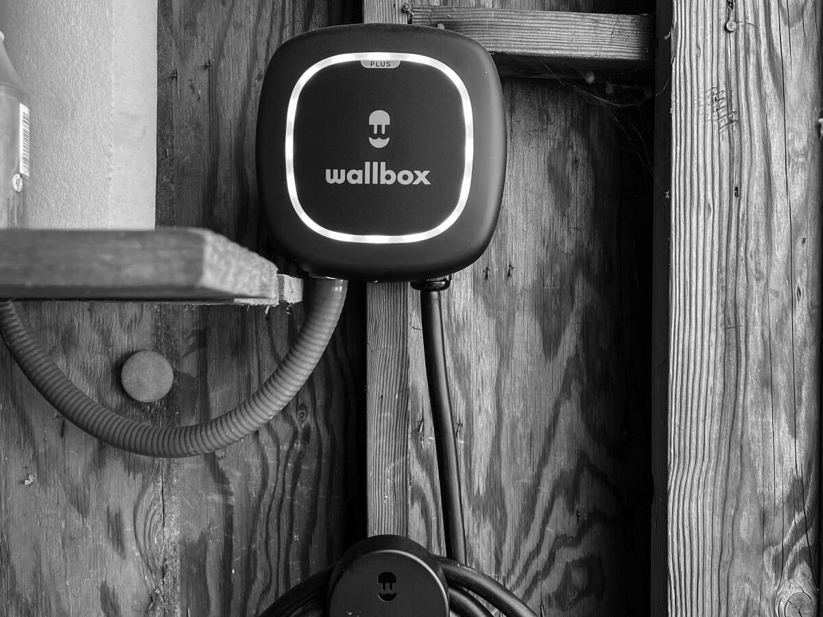 A Wallbox EV charger mounted on a wall.