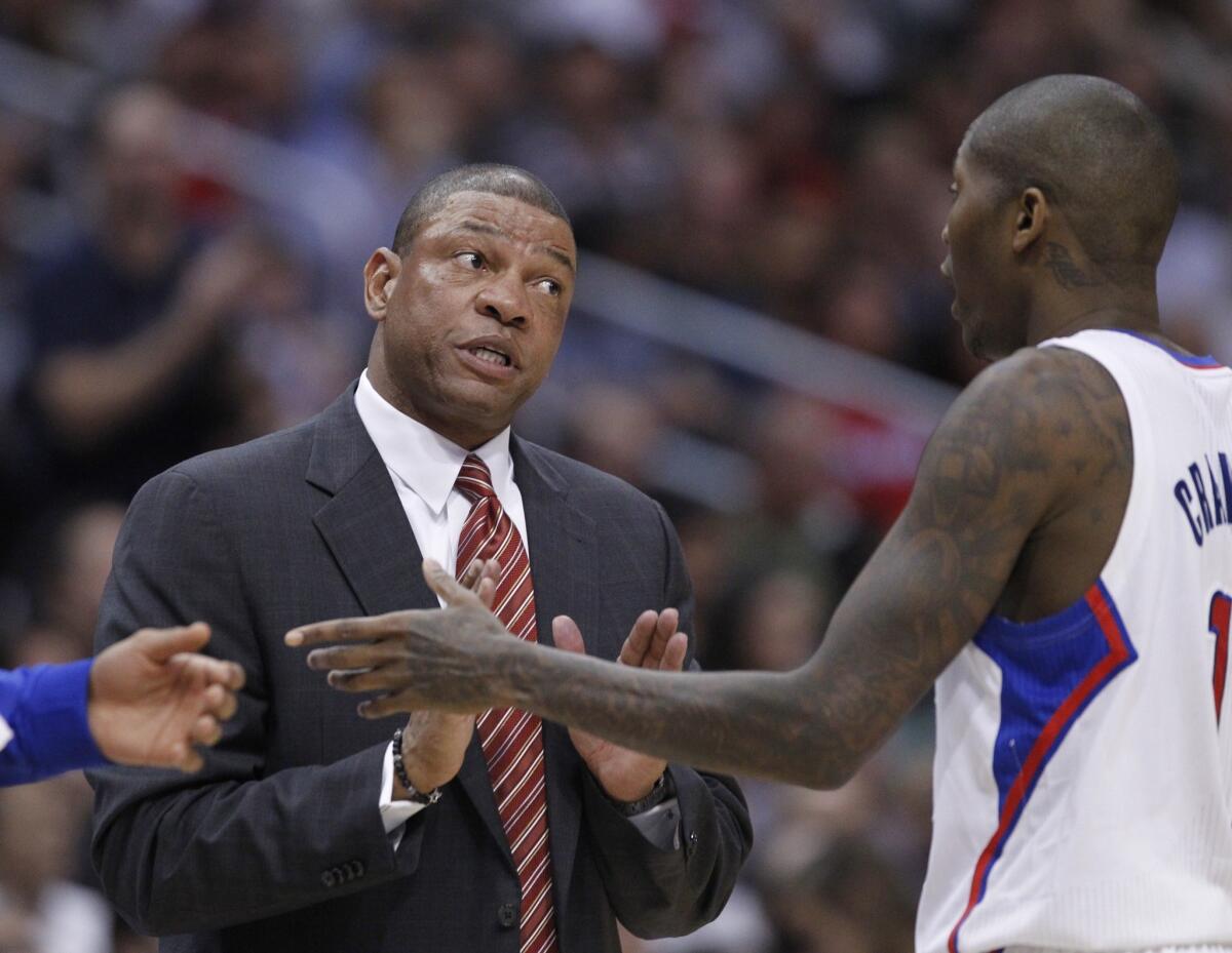Clippers Coach Doc Rivers, left, speaks with guard Jamal Crawford during the Clippers' 115-92 win over the San Antonio Spurs.