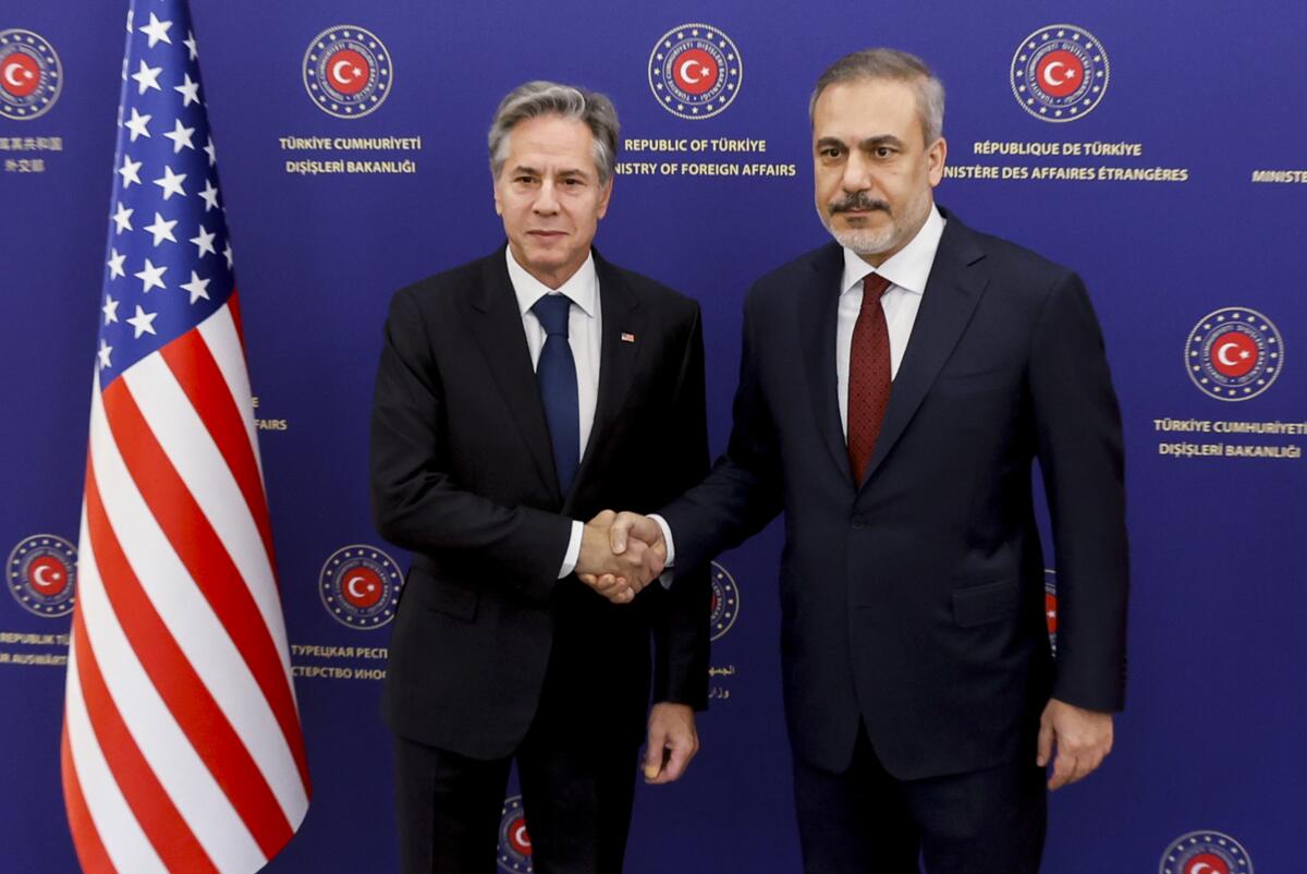U.S. Secretary of State Antony J. Blinken shaking hands with Turkey's foreign minister