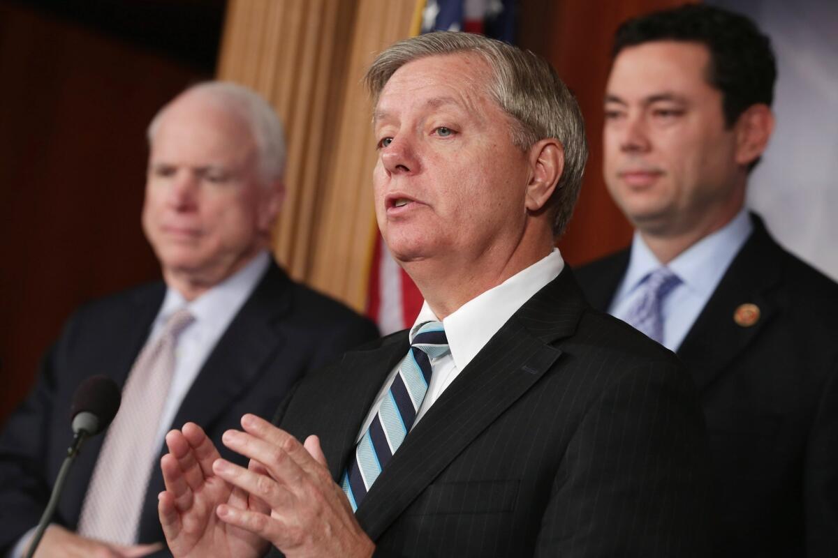 From left to right: Sen. John McCain (R-Ariz.), Sen. Lindsey Graham (R-S.C.) and Rep. Jason Chaffetz (R-Utah) hold a news conference about Benghazi at the U.S. Capitol in Washington, D.C.