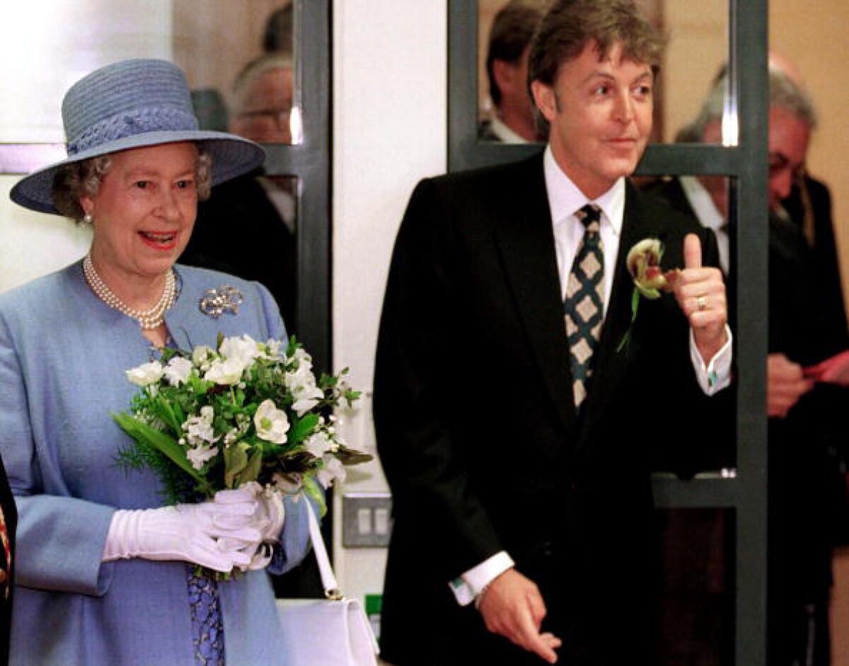Queen Elizabeth II and Paul McCartney.