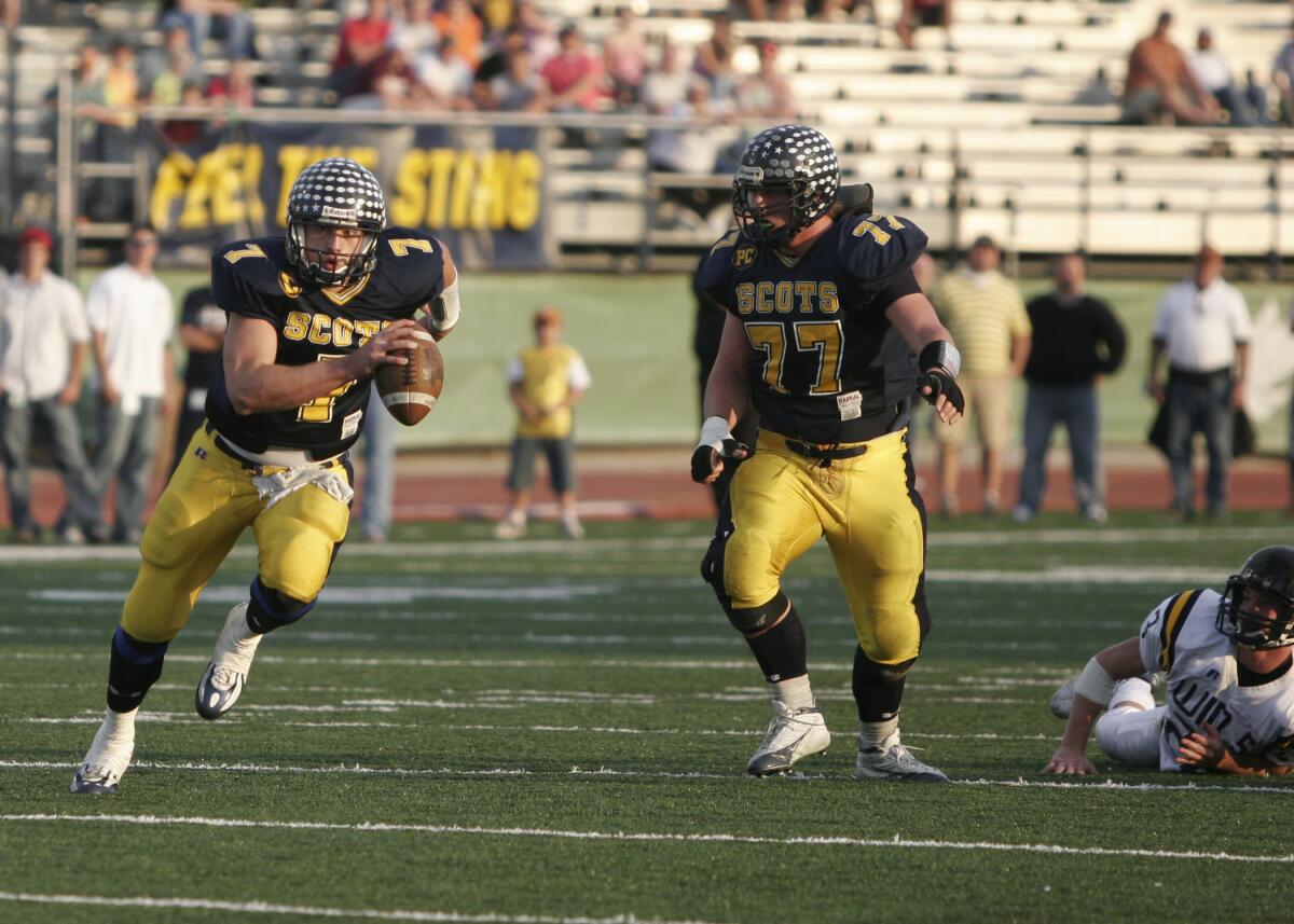  Highland Park quarterback Matthew Stafford runs during a playoff win over Stephenville on Dec. 3, 2005.