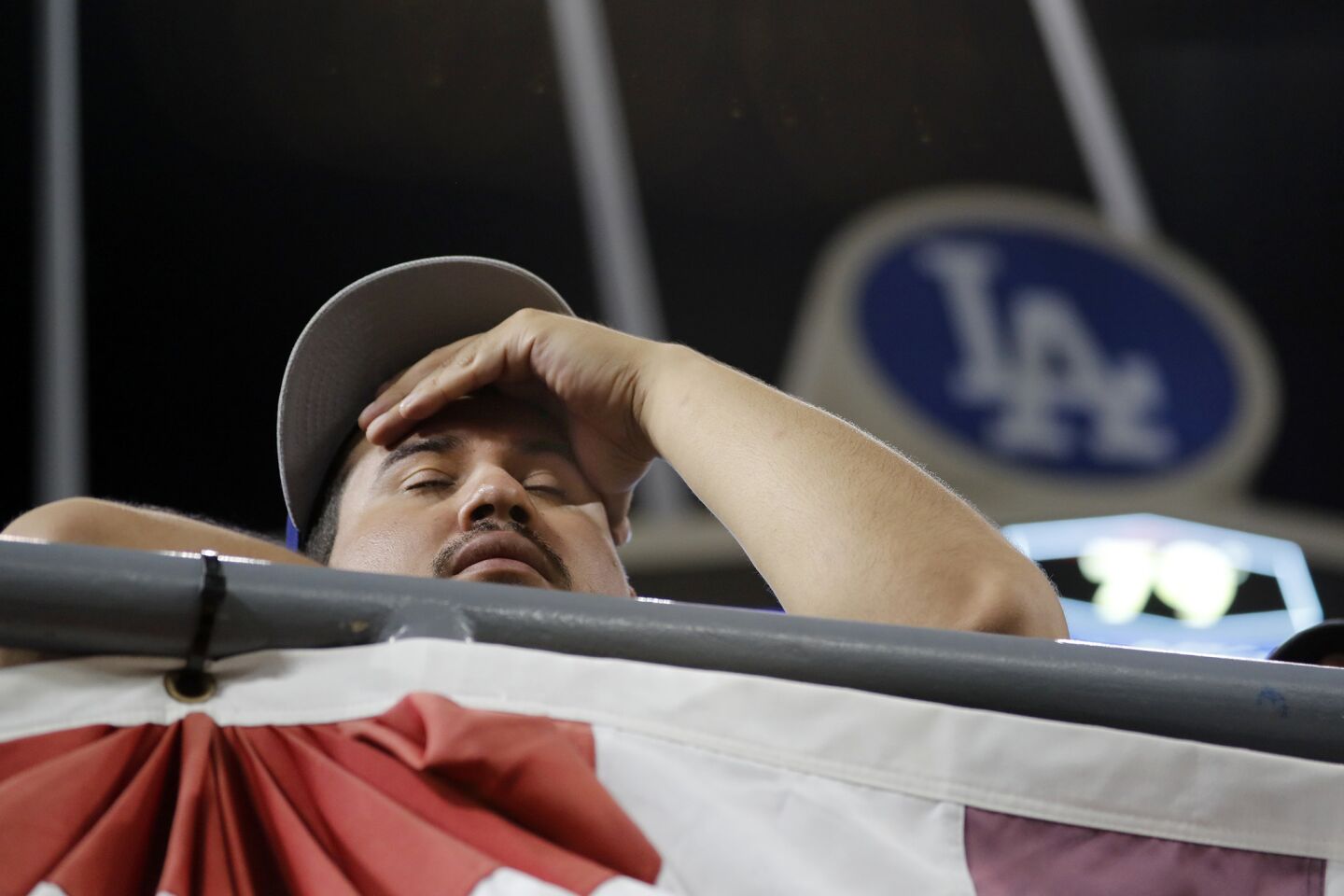 A fan watches Houston take a 7-6 victory in 11 innings on Wednesday night.