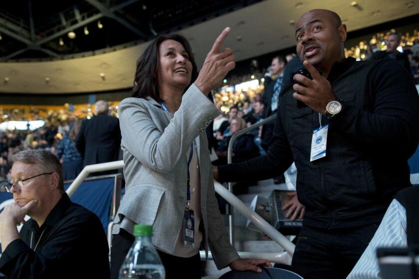 West Coast Conference Commissioner Gloria Nevarez talks with Oronde Taliaferro, an NBA scout for the Detroit Pistons, before a game between the Brigham Young University Cougars and the Gonzaga University Bulldogs held Thursday, Jan. 31, 2019, at the Marriott Center in Provo, Utah. (Isaac Hale / For The Times)