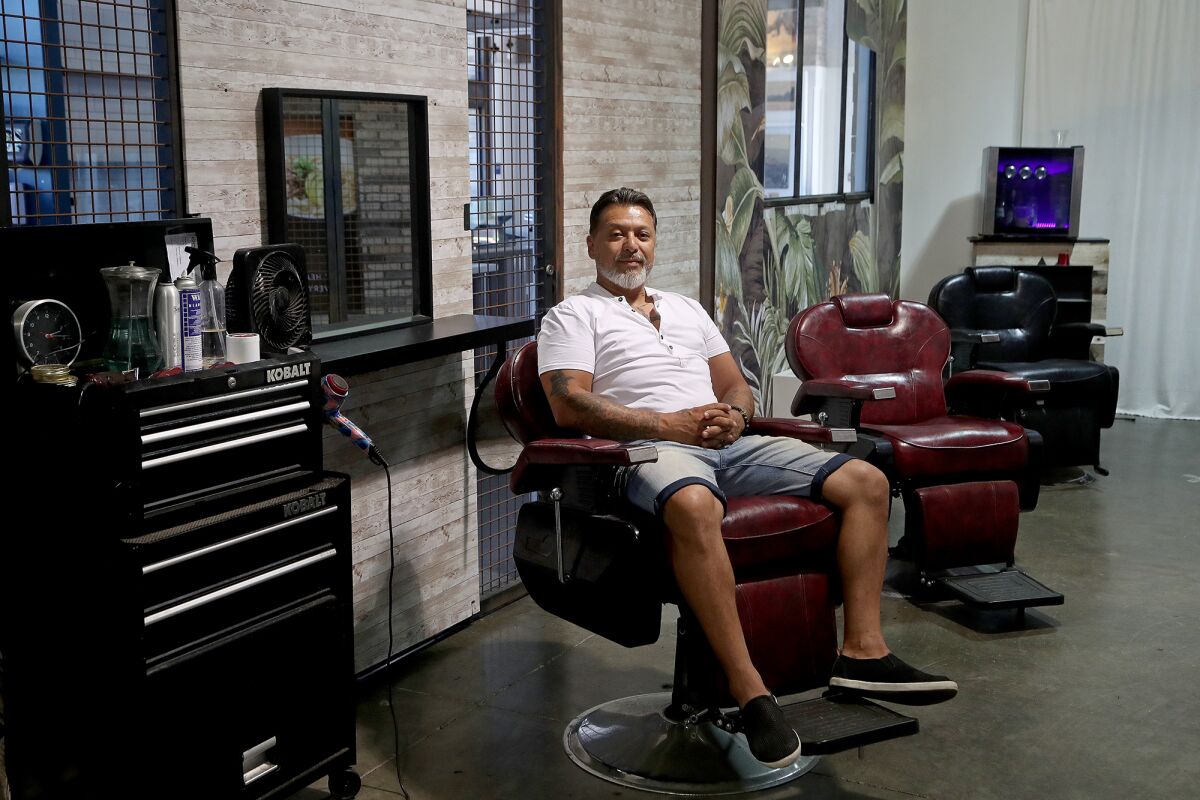 Owner Sebastian Cabrera at Black Steel Barbershop in the Union Market at the District at Tustin Legacy.