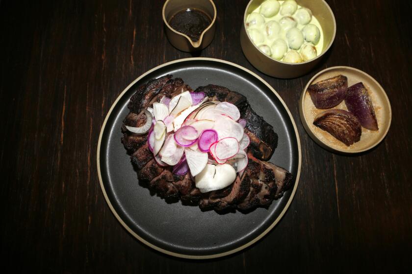 The Holstein rib-eye at the Koreatown restaurant Here's Looking at You is a wonderful piece of meat, dry-aged for 30 days and enhanced with melted radish butter.