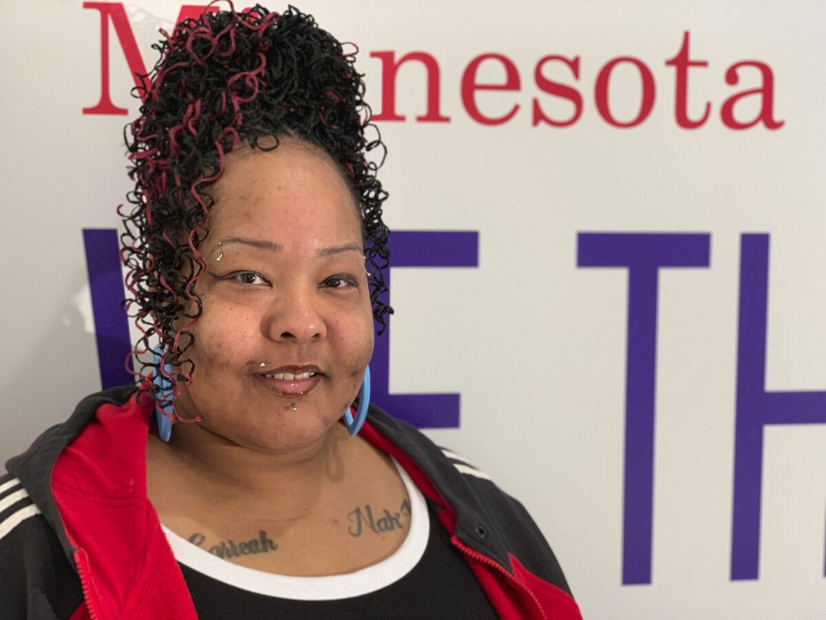Davida Conover, mother of a 13-year-old girl whose videotaped arrest in St. Paul, Minn., has sparked an angry backlash on social media, poses for a photograph, Saturday, Oct. 5, 2019, at the American Civil Liberties Union of Minnesota office in Minneapolis. Conover told The Associated Press that her daughter is "no angel" but was treated unfairly by police. (AP Photo/Jeff Baenen)