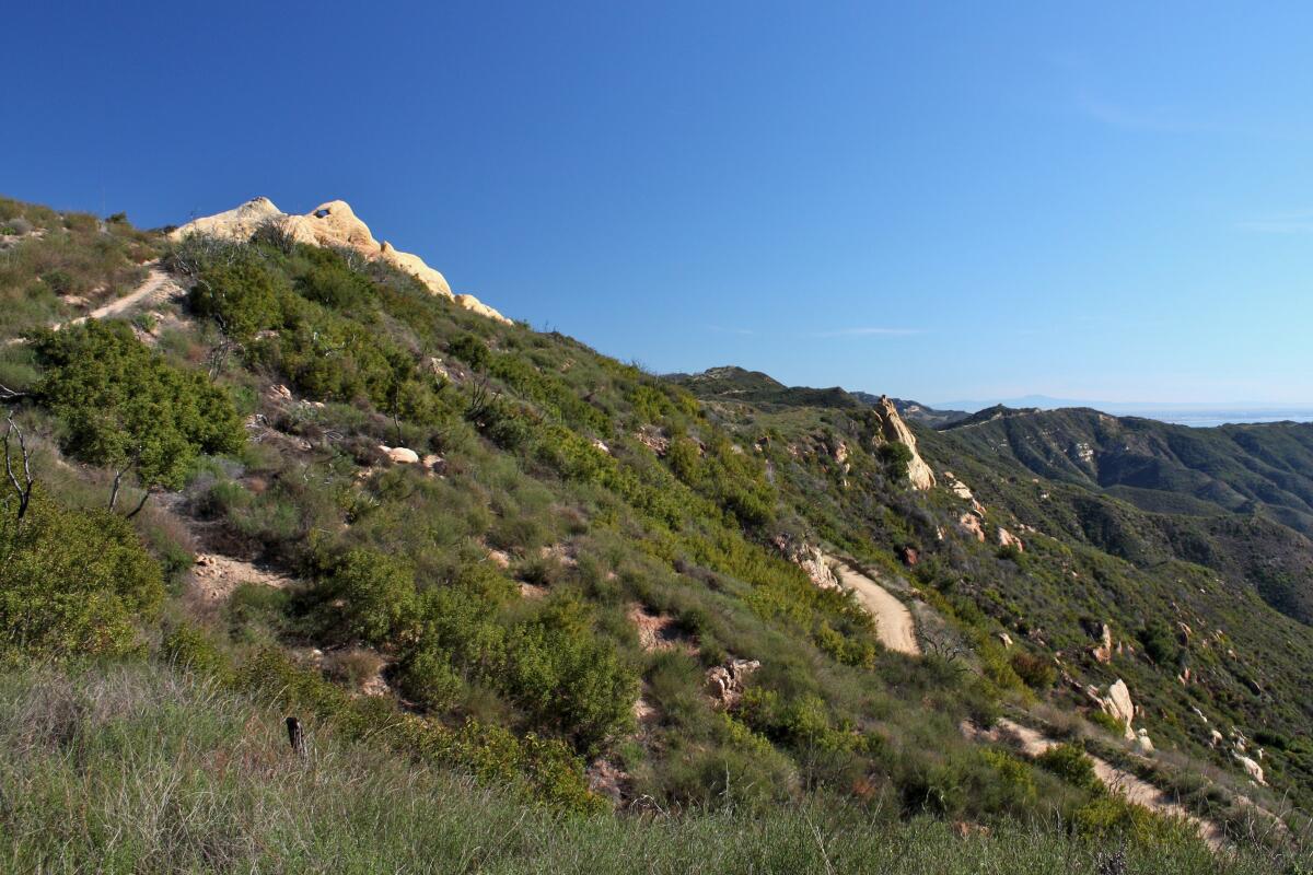 A clear sky over scrub-covered hills at Castro Crest.