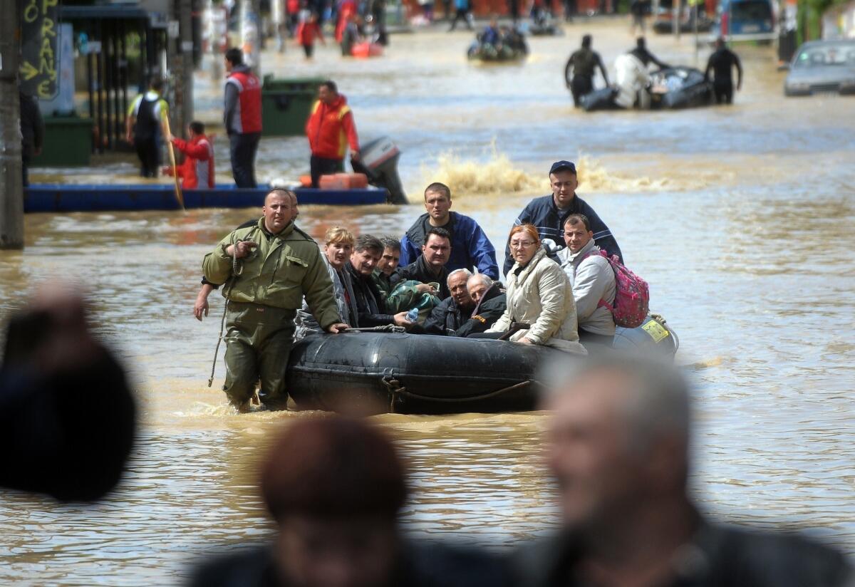 Thousands had to be evacuated from flood-ravaged Obrenovac, Serbia, after catastrophic storms in May. Rising global temperatures are contributing to an increased incidence of severe weather, the U.N.'s climate agency says.