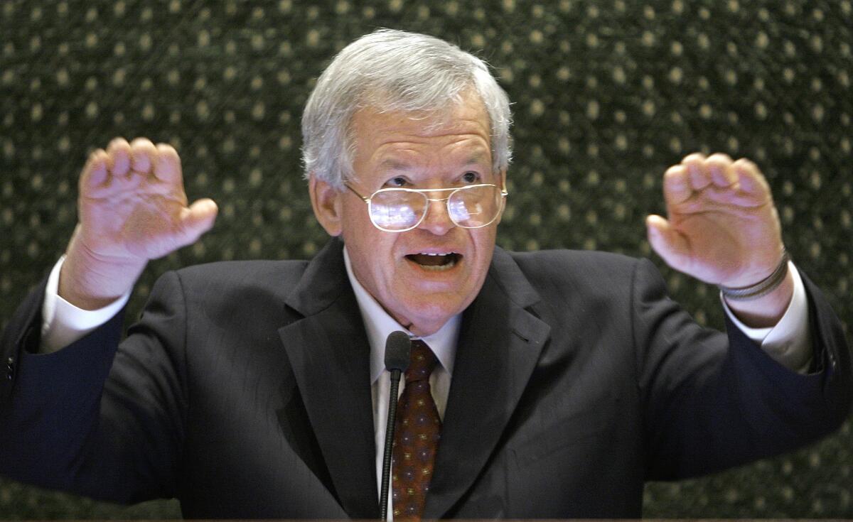 In this March 5, 2008, file photo, former U.S. House Speaker Dennis Hastert speaks to lawmakers on the Illinois House of Representatives floor at the state Capitol in Springfield, Ill. Federal prosecutors have indicted the former U.S. House Speaker on bank-related charges.