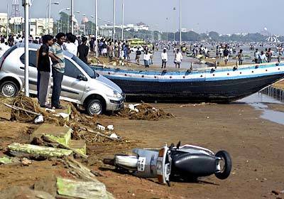 Vehicles, boats and other debris on Madras' Marina Beach after it was hit by tidal waves. There was deaths and damage along the entire coast of the southern Indian state of Tamil Nadu.