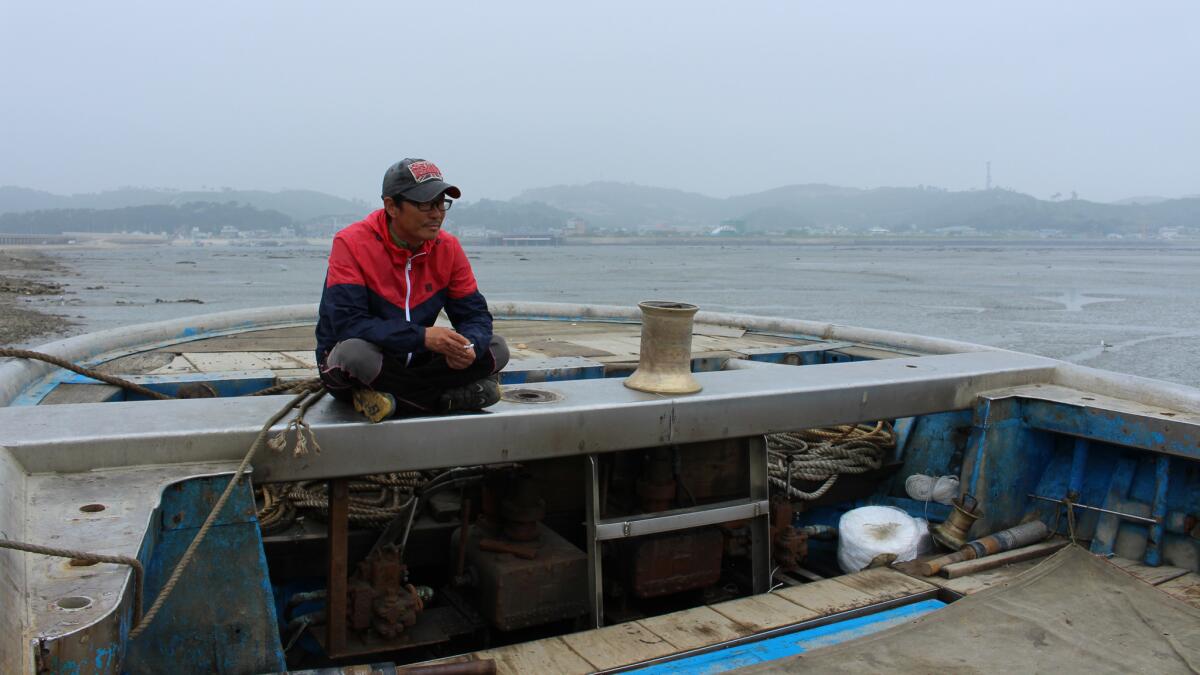 Fishermen Shin Hyung-geun sits in his boat on Yeonpyeong Island, South Korea, on June 11, 2016, after returning from sea.