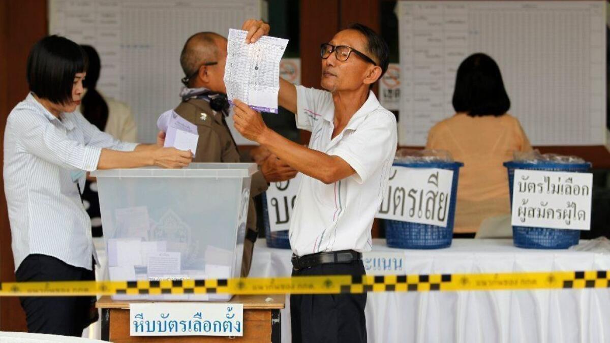 Electoral officials count ballots in Chiang Mai province after polls closed in Thailand's March 24, 2019, general elections.