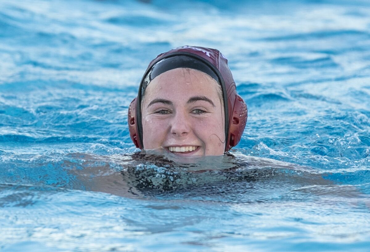 Laguna Beach's Lauren Short smiles after scoring a goal against Newport Harbor during a Surf League match on Tuesday.