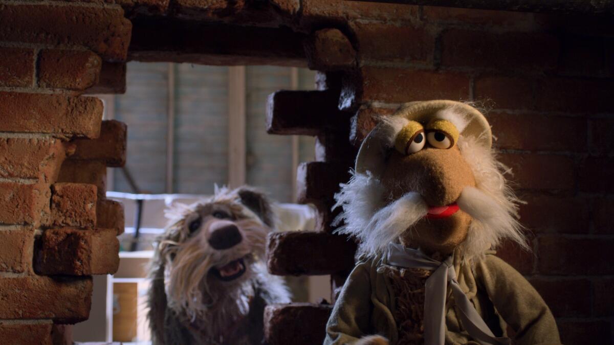 A dog looks through a hole in a brick wall as a whiskered muppet looks into "Outer Space."