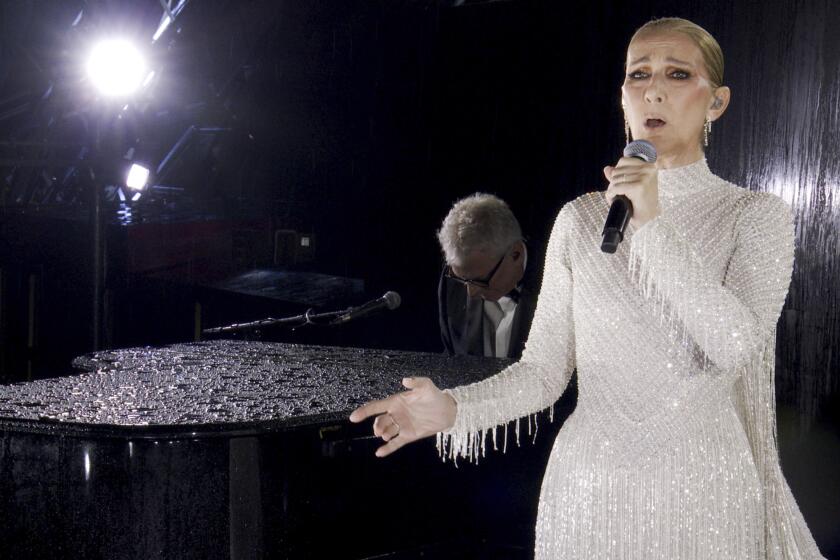 Celine Dion performing on the Eiffel Tower during the opening ceremony for the 2024 Summer Olympics in Paris, July 26, 2024.