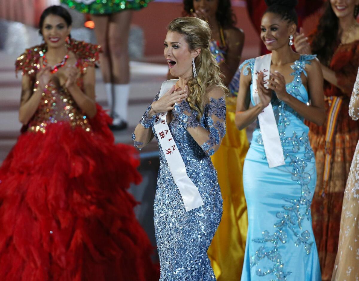 Mireia Lalaguna Royo of Spain, center, was named Miss World in a competition clouded by controversy in Sanya, China, on Dec. 19, 2015.